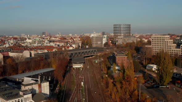 Berlin, Germany Cityscape with Train Entering a Station Next To Gasometer Famous Structure and TV