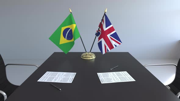 Flags of Brazil and Great Britain and Papers
