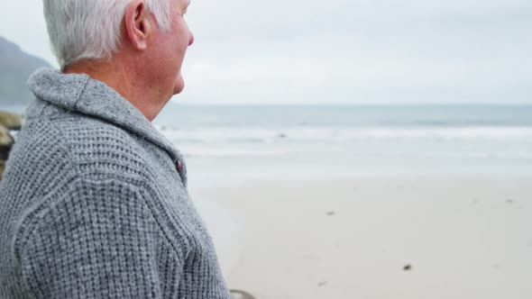 Senior couple embracing each other on the beach