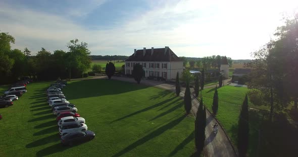 Just married couple arriving to the Bourbet Castle on scooter