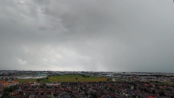 Timelapse Of Moody Overcast Grey Clouds Rolling Over Local Town. Locked Off