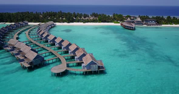 Tropical birds eye tourism shot of a white sand paradise beach and turquoise sea background in high 