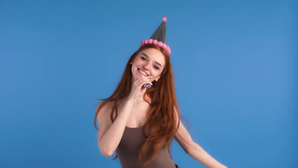 Ginger Female in Party Hat and Khaki Tank Top