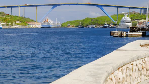 Queen Juliana Bridge over the beautiful Saint Anna Bay in Punda, Willemstad, on the Caribbean island