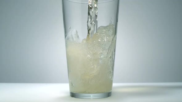 Ginger ale being poured in a glass, Slow Motion