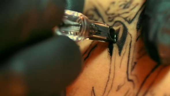 Very Close Filming of Working Tattoo Gun