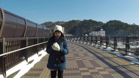 Cute Asian Girl Walking On The Bridge In Winter Day Slow Motion