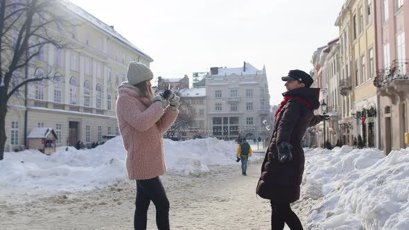 Sisters Couple Bloggers Taking Photo Pictures Posing Making Online Video Vlog on Mobile Phone