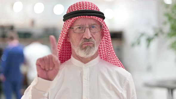 Senior Old Arab Businessman Saying No By Finger Sign