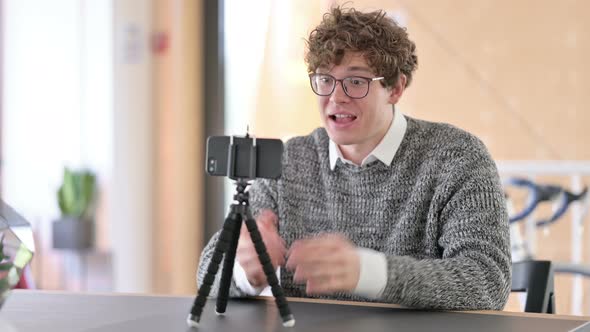 Young Man Doing Blogging, Video Recording on Camera 