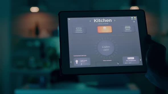 Close Up Shot of Tablet with Active Smart Home Application Holded By Man