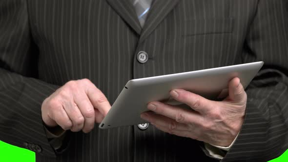 Man in Suit Scrolling Tablet, Close Up