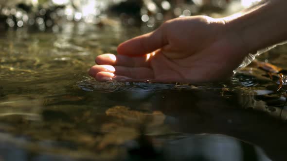 Scoop up a handful of water from creek, Slow Motion