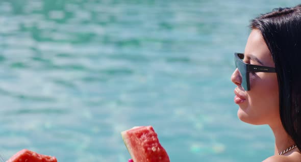 Relaxed Women in Sunglasses Eating Watermelon Near Poo