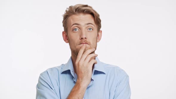 Approving Caucasian Male with Blue Eyes and Brown Beard on White Background in Slowmotion and