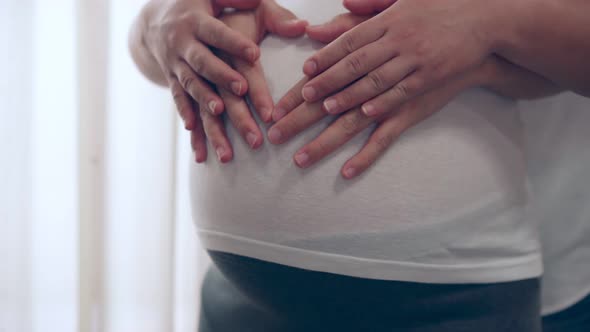 Pregnant Couple Feels Love and Relax at Home