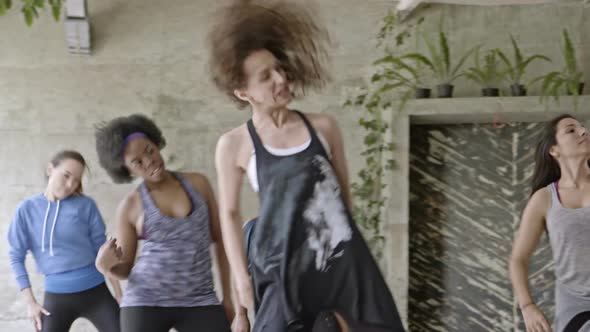 Dance Teacher Rehearsing with Young Women