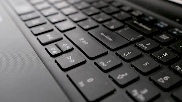 Keyboard Close Up with Black Keys.