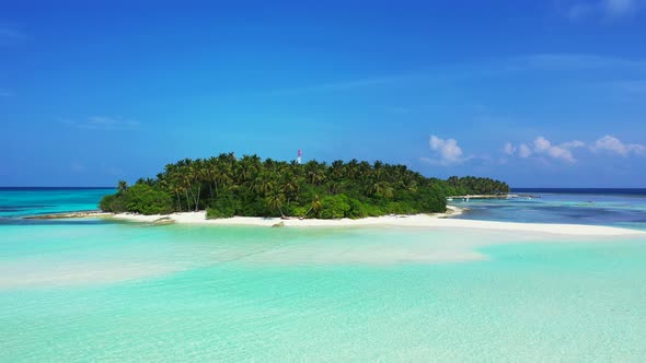 Wide angle flying travel shot of a sandy white paradise beach and aqua turquoise water background 