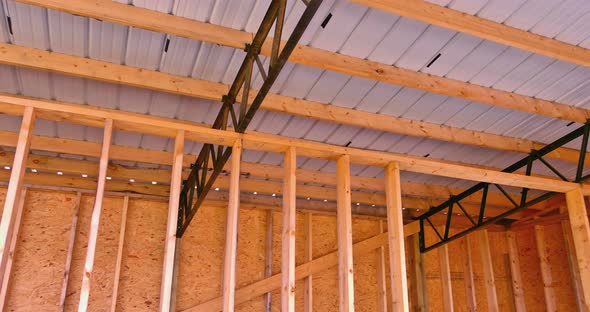 Building Frame Composition Ith Timber Joists Roofing Panels in Construction Site