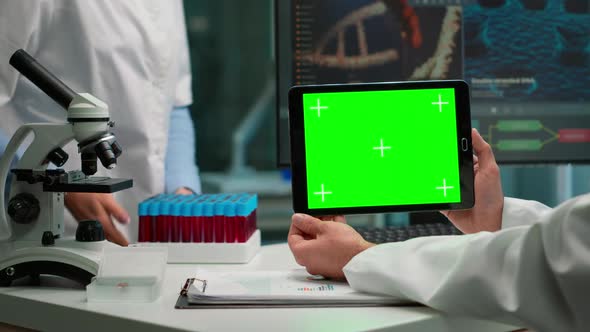 Back View of Chemist Man Holding Tablet with Green Mockup