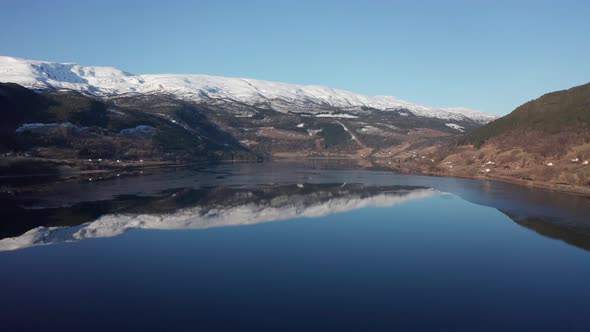 Vangsvatnet lake in Vossevangen shown with Bulken and Vosso river in background - Aerial overview wi