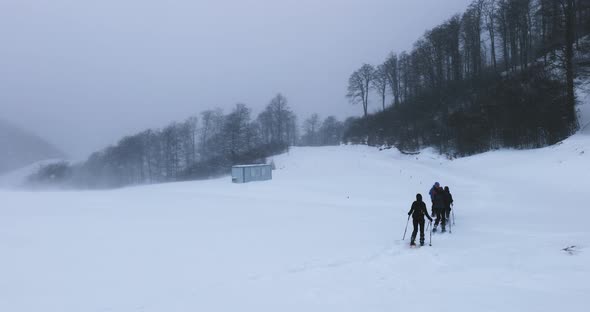 Mountaineers caught up in a strong blizzard on a winter day