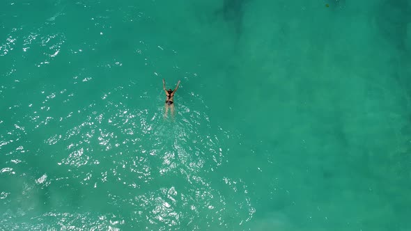 Young Woman Swimming in Beautiful Azure Ocean