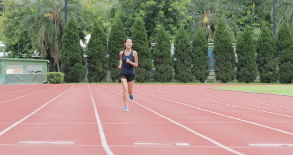 Woman running in sport arena
