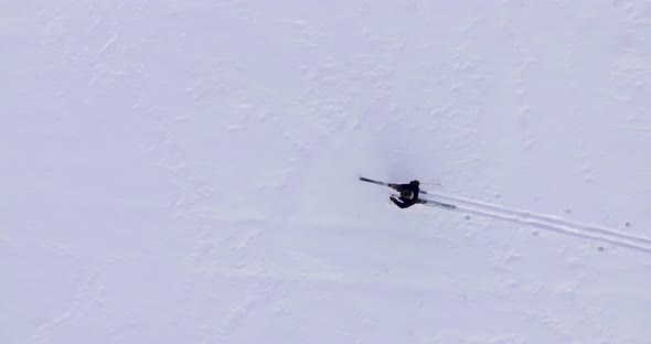 A Skier Walks In The Snow Zoom
