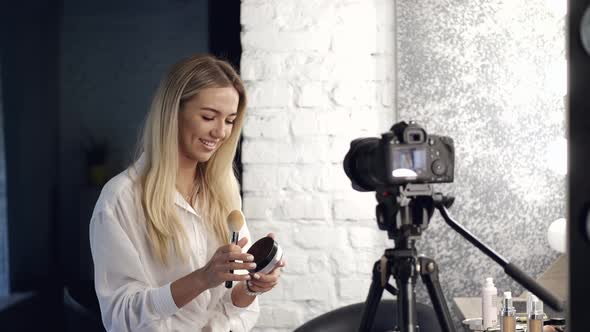 A Beautiful Makeup Artist Is Filming a Beauty Vlog in a Salon