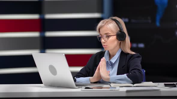 Trendy Blonde Businesswoman in Headset Talking Online Video Call Use Laptop at Innovation Office