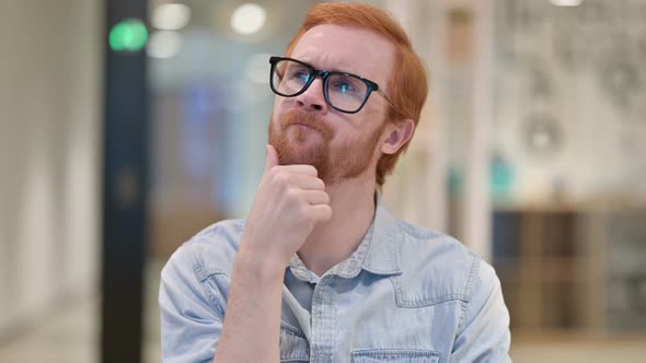 Portrait of Pensive Casual Redhead Man Thinking About Something 