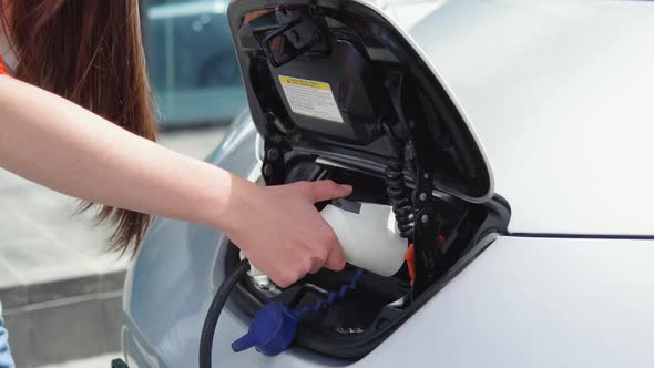 Girl Starts Charging Her Electric Car