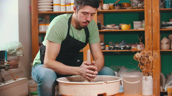 Pottery - Potter Master Is Pulling Clay in Length on a Potter's Wheel