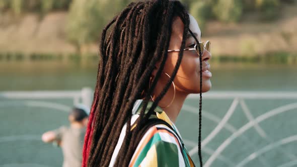 Portrait of Young AfroAmerican Girl Walking in the City