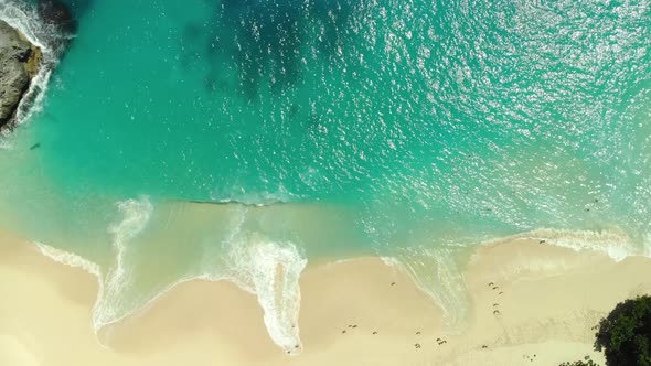 Beautiful Viewpoint of Kelingking Beach in Nusa Penid. Aerial View By Drone Ocean with Waves and