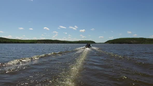 Motorboat sailing on lake