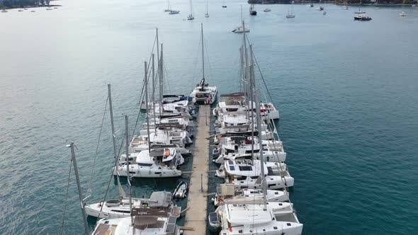 Aerial View of Poros Old Town and Marina or Seaport Greece  Drone Videography