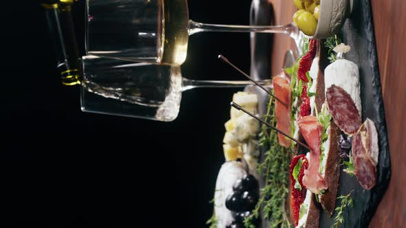 Vertical Video Pouring Wine in Italian Restaurant with Traditional Food Spanish Cuisine Delicious