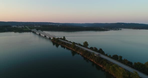 Aerial view of a bridge at Table Rock Lake in Missouri with a boat traveling under the bridge