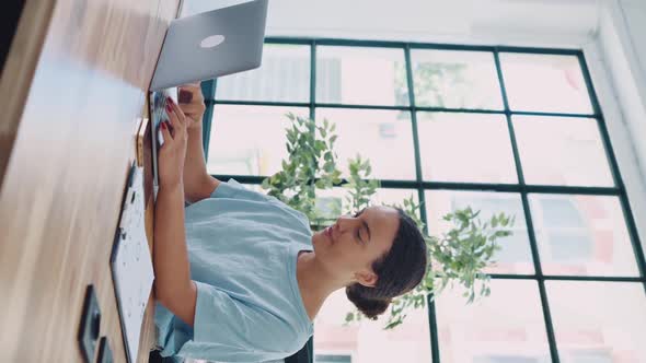 Vertical Video of a Positive Lovely Elegant Brazilian or Hispanic Young Woman Broker Creative