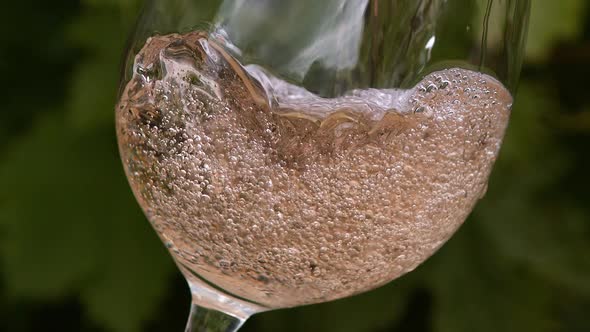 Pink Wine being poured into Glass, Slow motion