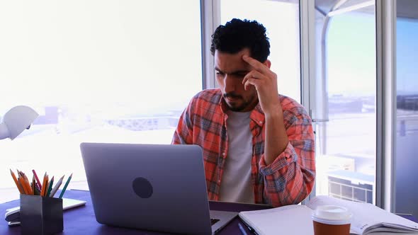 Male executive working over laptop 4k