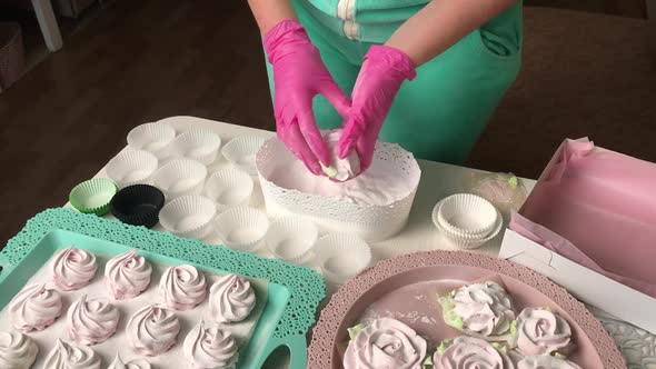 A Woman Prepares Marshmallows For Packaging.