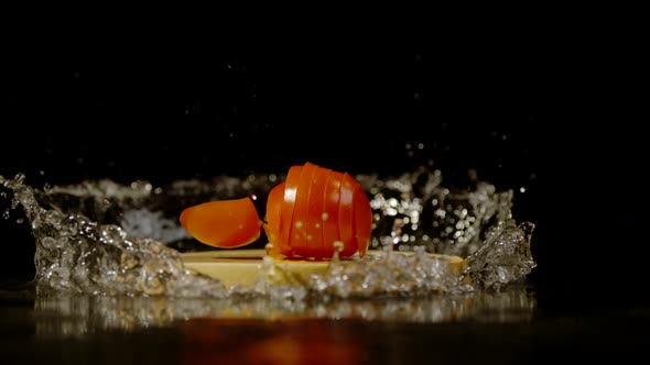 Sliced tomato and  cutting board falling, Ultra Slow Motion