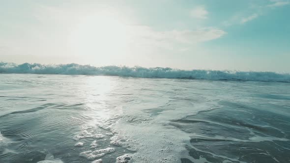 One surfer man surfing and riding a big wave in the sea or ocean at the beach outdoor