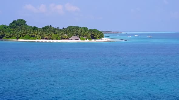 Aerial drone texture of resort beach by blue ocean and sand background