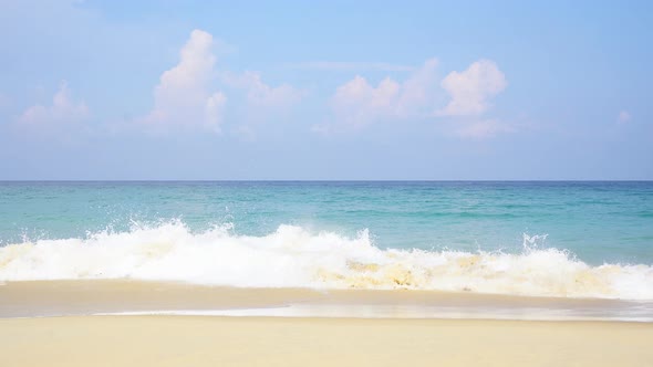 Beach blue sky wave foamy turquoise sea sunny background.