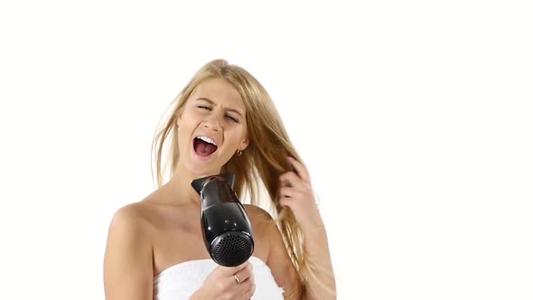 Woman in Bathroom Drying Hair with Blow Dryer, Slow Motion, Bathroom